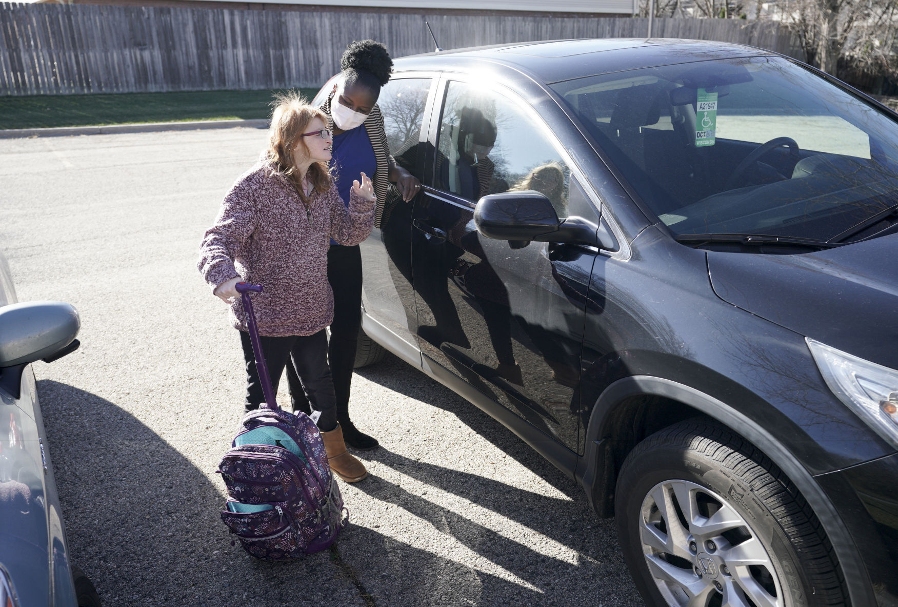 Erika and Teddy by car